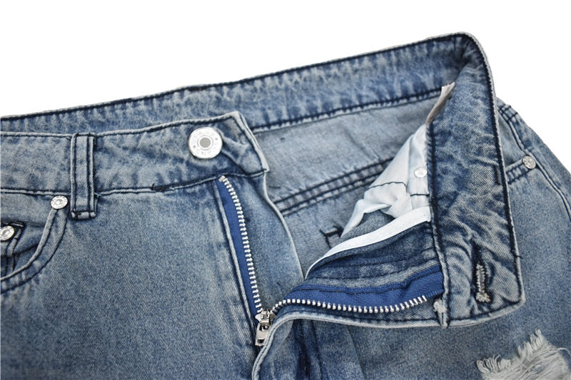 Calça jeans feminina rasgada streetwear com pernas folgadas